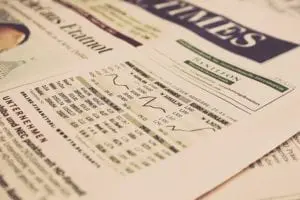 Newspaper showing business stocks and news