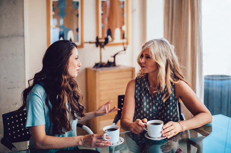 Mother and daughter speaking to each other about deciding on an attorney-in-fact