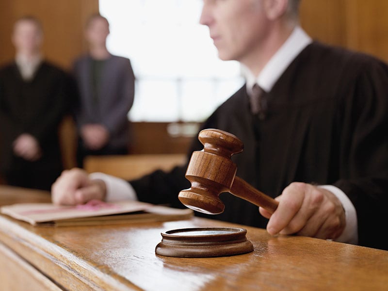 Judge using a gavel in court