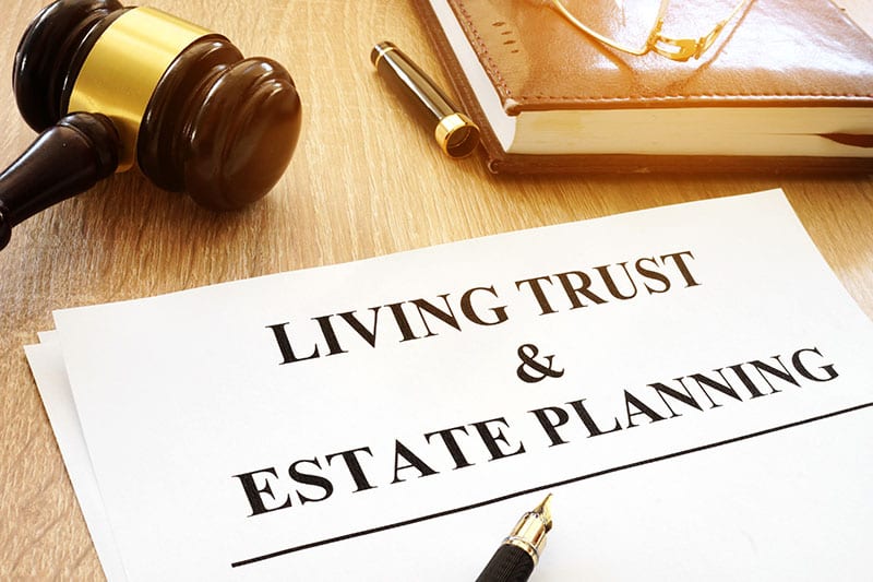 Photo of a document that reads “Living Trust & Estate Planning”