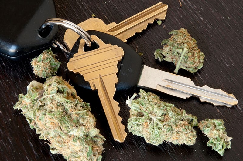 Photo of marijuana drug next to keys to a car