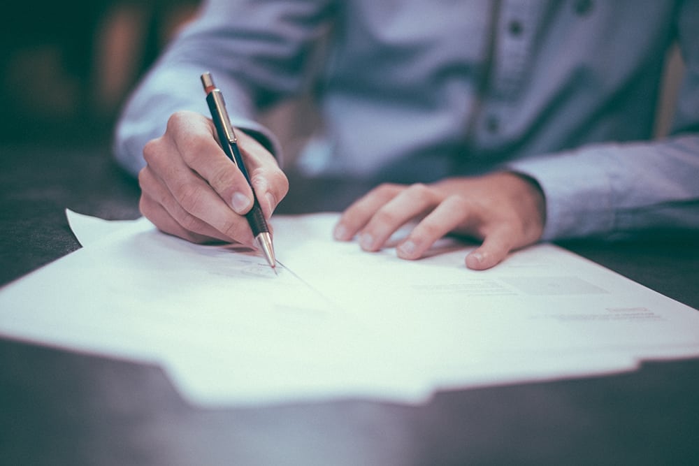 Man signing estate planning legal documents